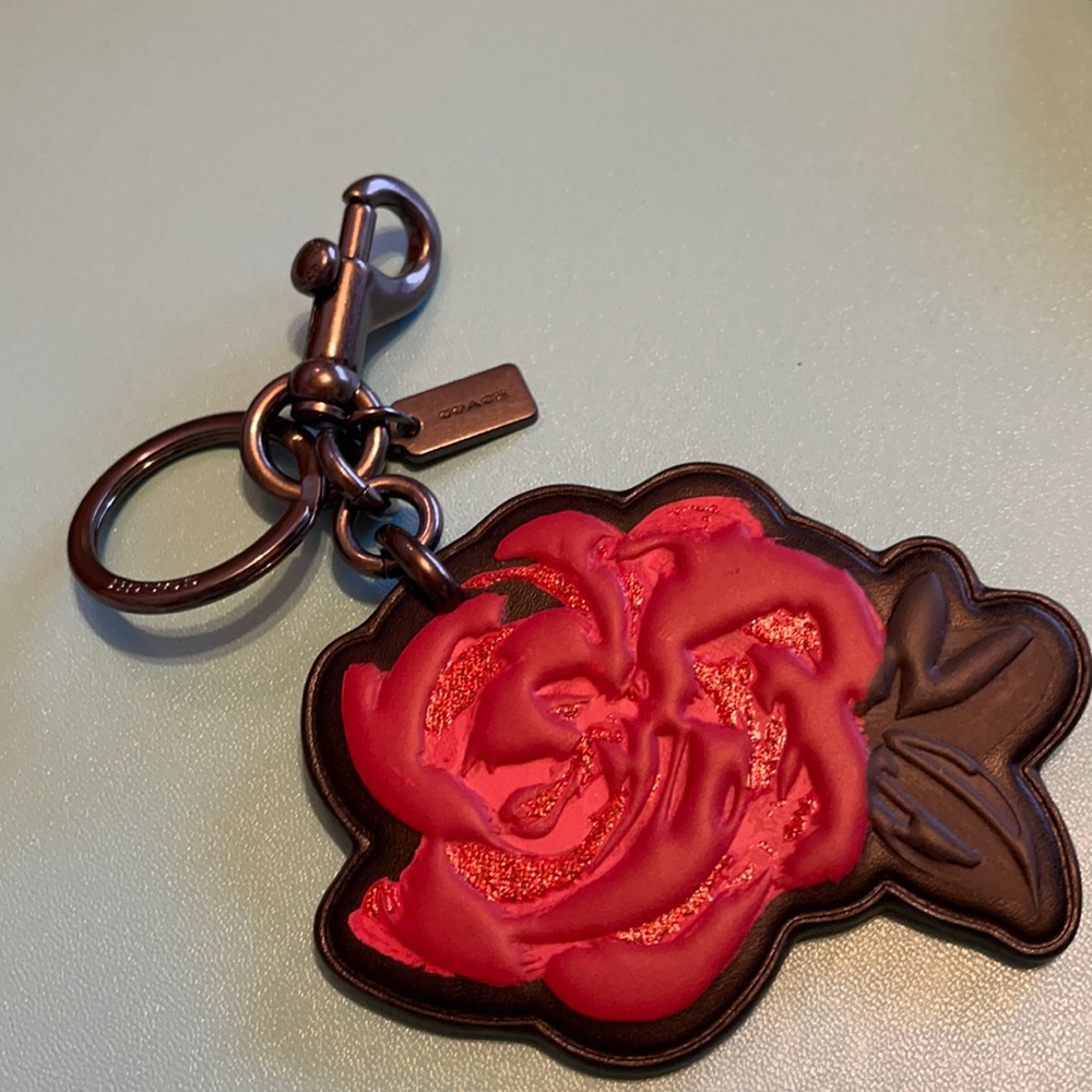 Coach red rose keychain.